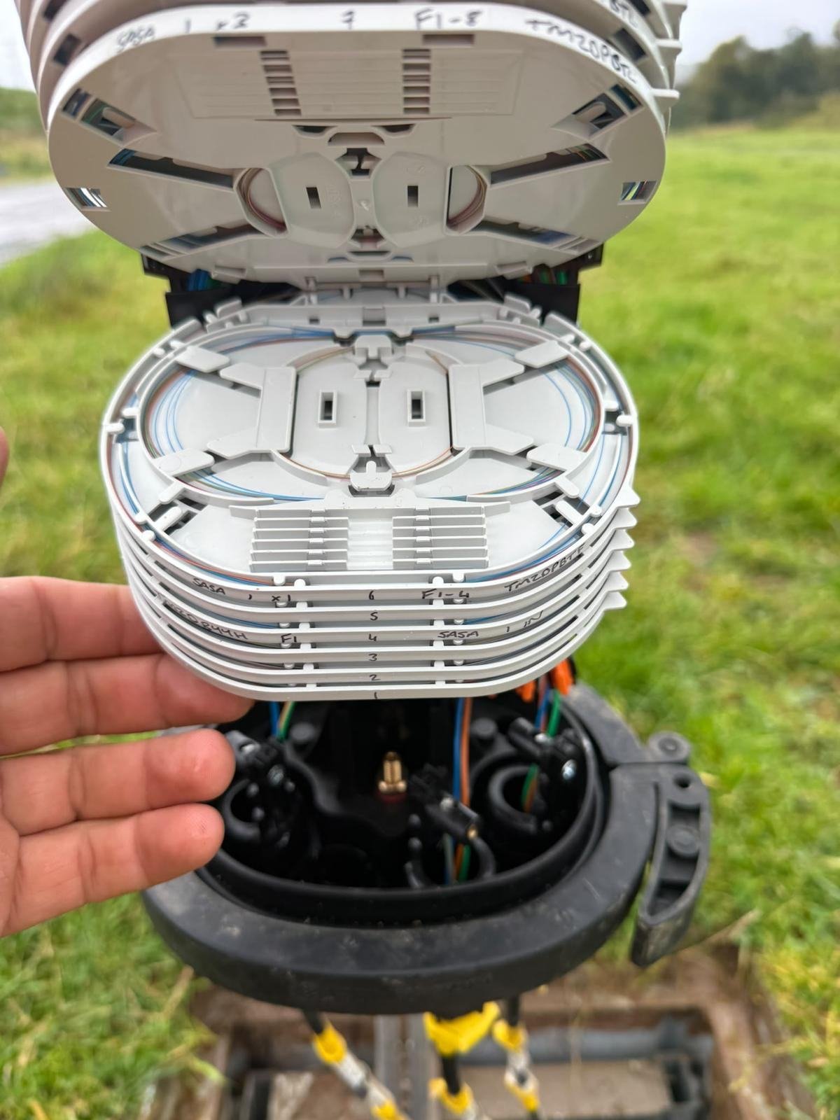 Fibre closure opened to show stacked splice trays